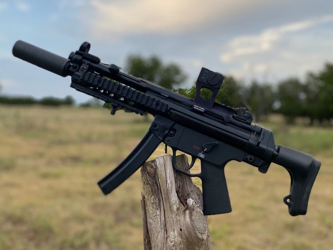 Suppressed MP5K with the Hansel MP5 optics mount and Aimpoint ACRO P-2 red dot